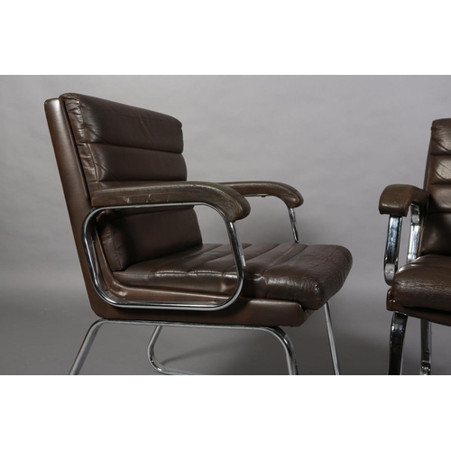 24 - Gordon Russell for Verco, c1970s, a pair of brown leather and chrome office desk chairs