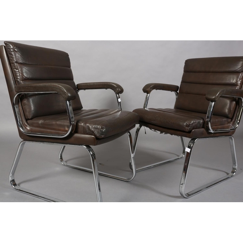 25 - Gordon Russell for Verco, c1970s, a pair of brown leather and chrome office desk chairs