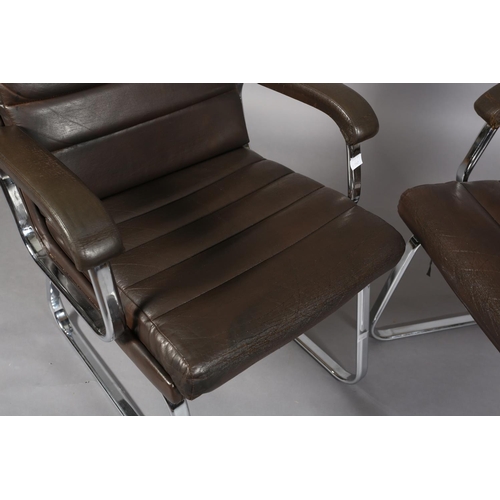 25 - Gordon Russell for Verco, c1970s, a pair of brown leather and chrome office desk chairs