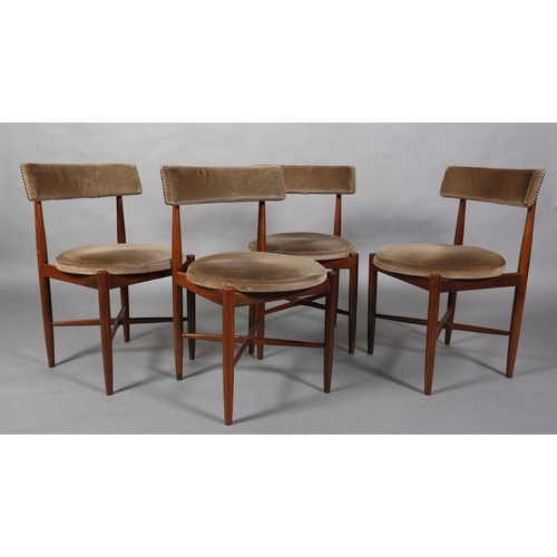 69 - A set of four G Plan Fresco teak dining chairs upholstered bar back and circular seats on rounded le... 