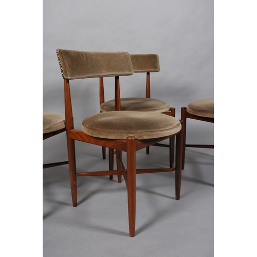 69 - A set of four G Plan Fresco teak dining chairs upholstered bar back and circular seats on rounded le... 