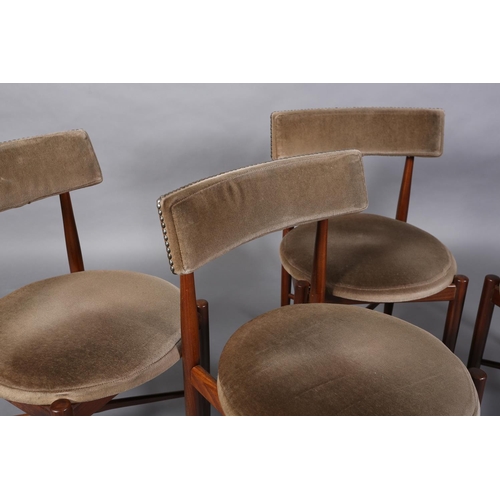 69 - A set of four G Plan Fresco teak dining chairs upholstered bar back and circular seats on rounded le... 