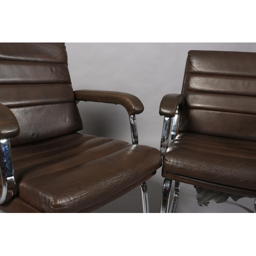 26 - Gordon Russell for Verco, c1970s, a pair of brown leather and chrome office desk chairs