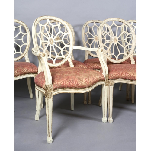 169 - A set of eight Regency style cream and gilt dining chairs with oval pierced backs and moulded frame,... 