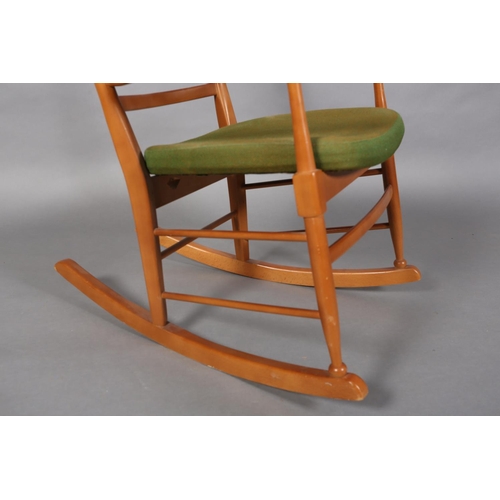 119B - A polished beech ladder back rocking chair with upholstered seat