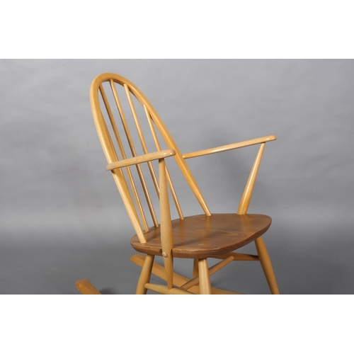 31 - An Ercol Quaker beech rocking chair, model 428 with natural elm seat