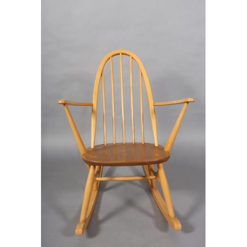 31 - An Ercol Quaker beech rocking chair, model 428 with natural elm seat