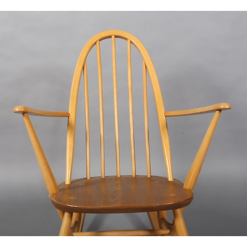 31 - An Ercol Quaker beech rocking chair, model 428 with natural elm seat