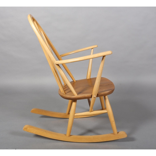 31 - An Ercol Quaker beech rocking chair, model 428 with natural elm seat