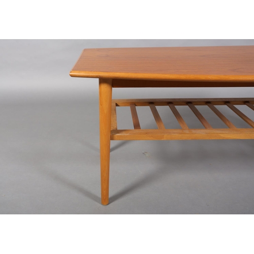 50 - A Danish teak and beech coffee table of rectangular curved outline with railed undertier, 120cm wide... 