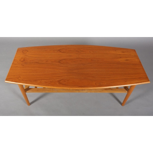 50 - A Danish teak and beech coffee table of rectangular curved outline with railed undertier, 120cm wide... 