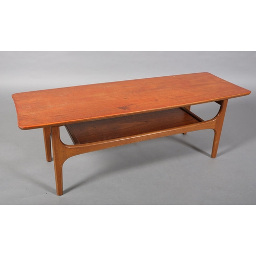 135 - A teak coffee table, c1970s, in the manner of Richard Hornby, rectangular and tapered with undertier... 