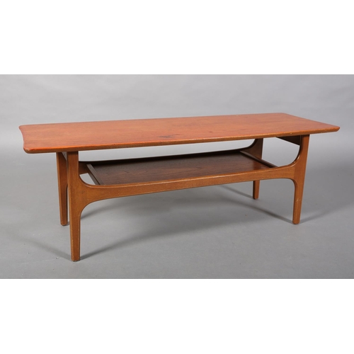 135 - A teak coffee table, c1970s, in the manner of Richard Hornby, rectangular and tapered with undertier... 