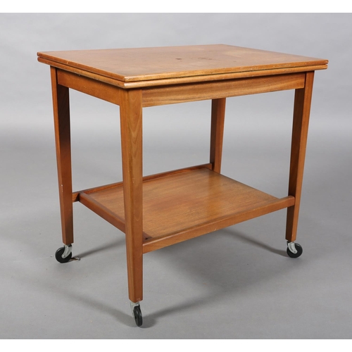 136 - A teak trolley by Eastcraft, Scotland, with rectangular fold over top, lined in baise and an underti... 