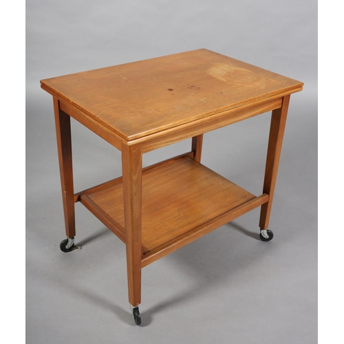 136 - A teak trolley by Eastcraft, Scotland, with rectangular fold over top, lined in baise and an underti... 