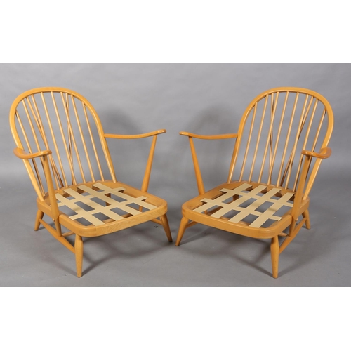 32 - A pair of Ercol Windsor beech armchairs, model 203 with loose back and seat cushions, (Please note: ... 