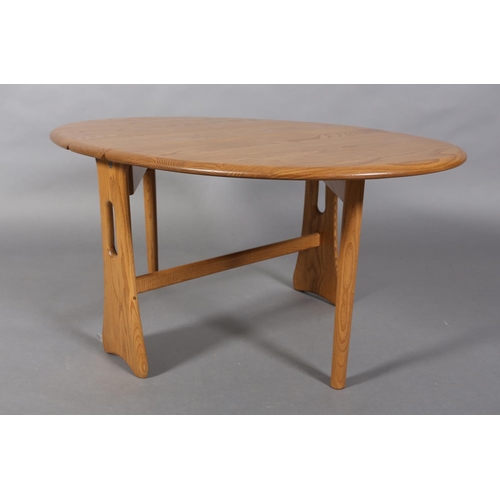 33 - A modern Ercol Windsor gateleg occasional table in natural oak, oval on pierced refectory supports, ... 