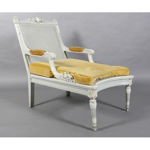 170 - A French style bergere-caned armchair, the pale grey and white frame with basket of flowers cresting... 