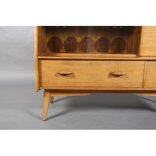 68 - An early G Plan walnut sideboard, c1960s, fitted with three narrow drawers above two glass sliding d... 