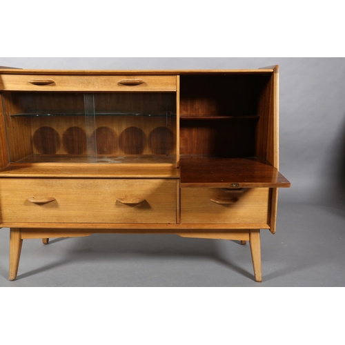 68 - An early G Plan walnut sideboard, c1960s, fitted with three narrow drawers above two glass sliding d... 