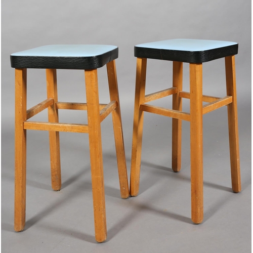 160 - A pair of English Maid beech stools, c1960s, with blue and black leather effect seats, 62cm high