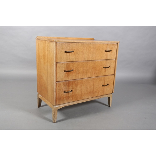 161 - A Lebus pale oak veneered chest of three graduated drawers with metal bar handles on slender bracket... 