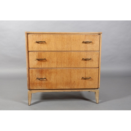 161 - A Lebus pale oak veneered chest of three graduated drawers with metal bar handles on slender bracket... 