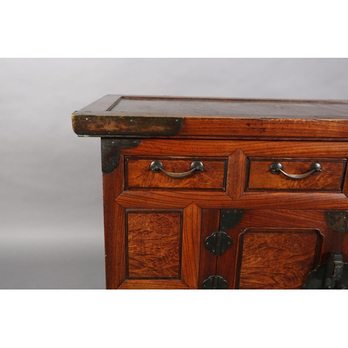 107 - A Korean elm and brass mounted cabinet, early 20th century indented panel top above a burr elm panel... 