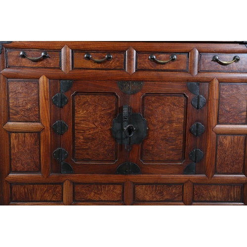 107 - A Korean elm and brass mounted cabinet, early 20th century indented panel top above a burr elm panel... 