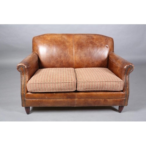 57 - A brown leather close-nailed two seater sofa in the 1920s style, having two cushion seat with interc... 