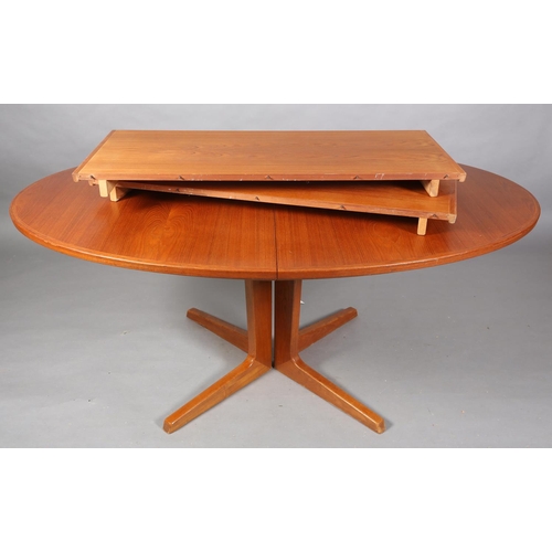 75 - A Bernhard Pedersen teak oval extending dining table, oval on a four section pedestal and feet, with... 