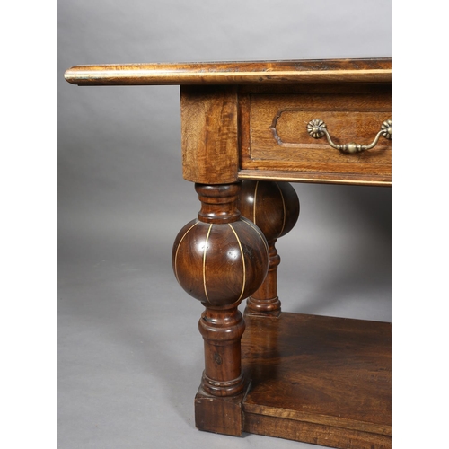 131 - An Italian hardwood hall or serving table, rectangular, having three drawers to the apron with brass... 