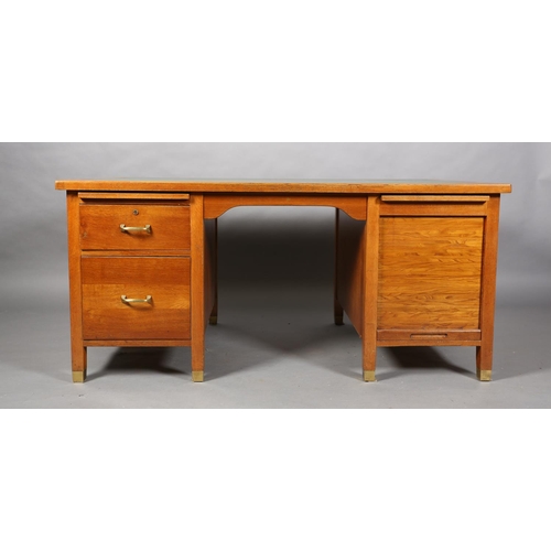 162 - A mid 20th century oak desk, having a green rexine incised surface, slide, drawer and filling drawer... 