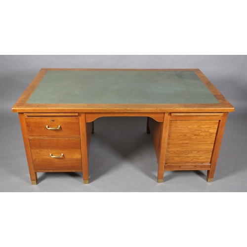 162 - A mid 20th century oak desk, having a green rexine incised surface, slide, drawer and filling drawer... 