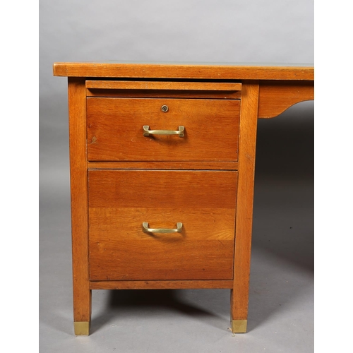 162 - A mid 20th century oak desk, having a green rexine incised surface, slide, drawer and filling drawer... 