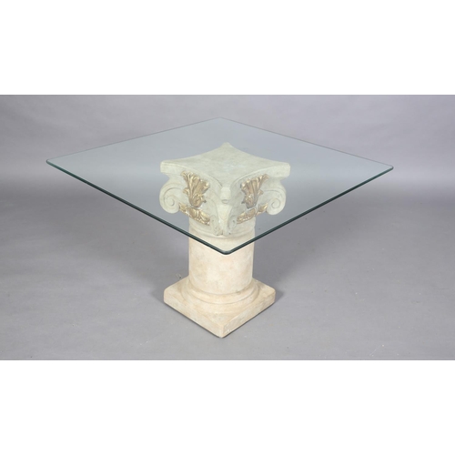 169B - A glass topped occasional table, square on a faux stone ionic column, pedestal with gilt highlights,... 