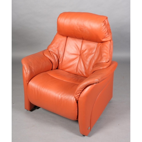 58 - A fox red leather electric reclining armchair by Himolla