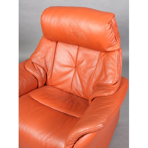 58 - A fox red leather electric reclining armchair by Himolla