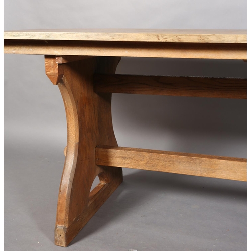 152 - An oak refectory table, planked top on waisted standards joined by a low and a high stretcher, 262cm... 