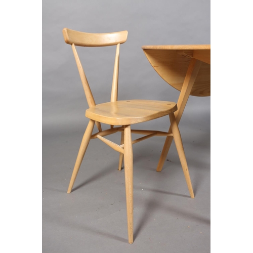 35 - A modern Ercol beech circular drop leaf dining table, on square tapered splayed legs together with a... 