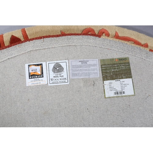 102 - Theko Ambadi rug, circular, in salmon pink, cream and russett, 152cm diameter