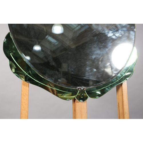 125 - An Art Deco wall mirror, of shield shape, bevelled and etched with green panels to the lower edge, 6... 