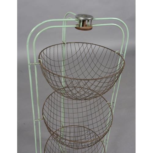 153 - The Happy Maid vegetable holder, green metal rod and triple wire baskets, 78cm high