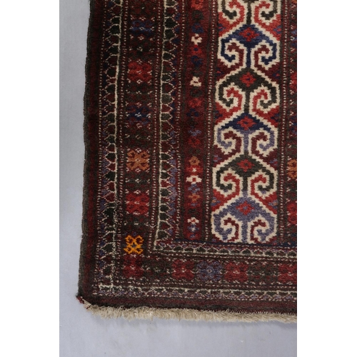 142 - A small Caucasian prayer rug, the prayer niche filled with three rows of blue, dark brown and off-wh... 