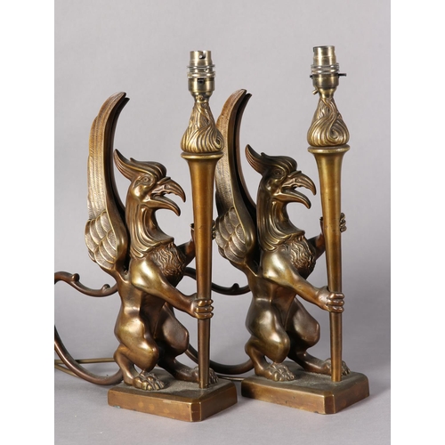 174 - A pair of bronze-effect griffin and torchere table lamps, 41.5cm high including fitting