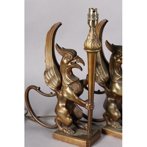 174 - A pair of bronze-effect griffin and torchere table lamps, 41.5cm high including fitting