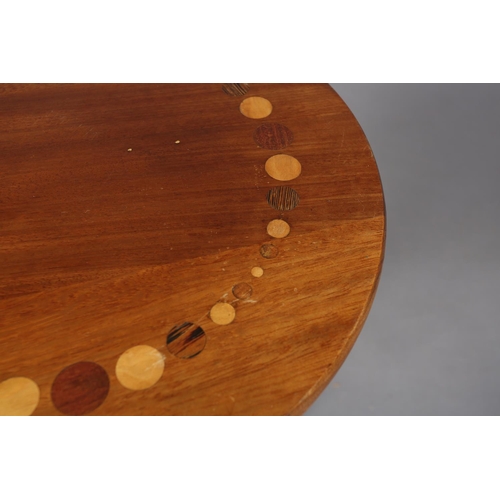 121 - A walnut tripod table, the circular top inlaid in exotic woods with a ring of circles of various siz... 