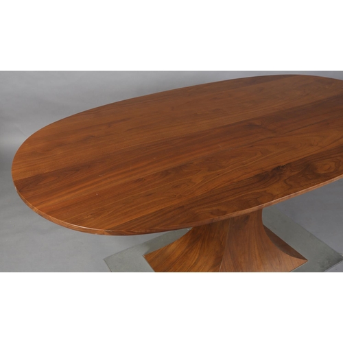 36 - A walnut and steel oval pedestal dining or centre table, the pedestal of waisted rectangular form on... 