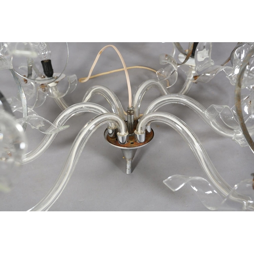 22 - A six light crystal pendant light, having six glass scrolled arms, each terminating in two spiral ch... 