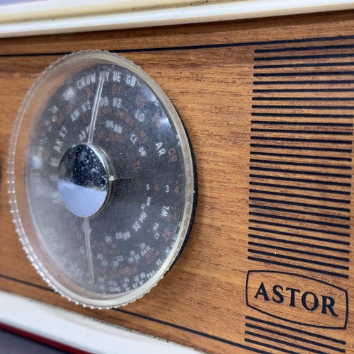 93 - A 1960s Astor radio, in red and cream plastic case with teak front panel, made in Australia, 35cm wi... 